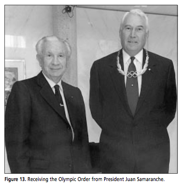 Receiving the Olympic Order from President Juan Samaranche.